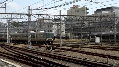 Metro-train-departs-from-station-in-Kyoto,-Japan