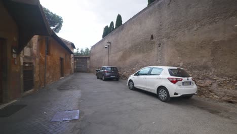 Rome-Immersive-POV:-Moving-In-Busy-Streets-to-Chiesa-Santi-Luca-e-Martina,-Italy,-Europe,-Walking,-Shaky,-4K-|-Family-Leaving-Entrance-of-Church