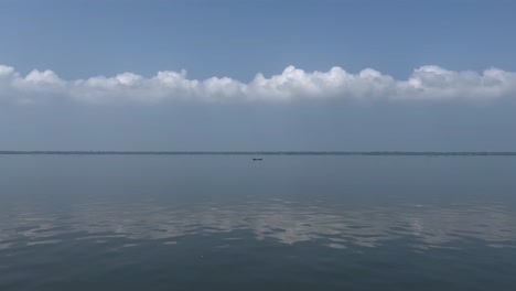 pov-shot-A-boat-is-going-in-the-middle-of-the-water-and-there-are-small-waves-in-the-water-cinematic-shot