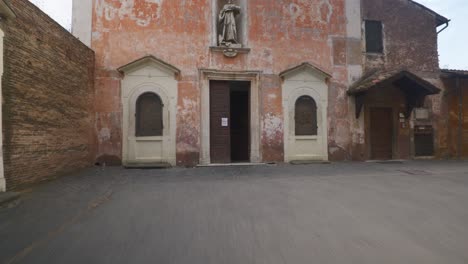 Rome-Immersive-POV:-Moving-In-Busy-Streets-to-Chiesa-Santi-Luca-e-Martina,-Italy,-Europe,-Walking,-Shaky,-4K-|-Man-Leaving-Church-Door