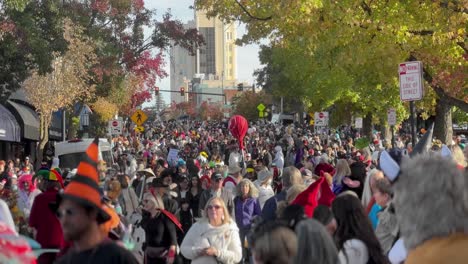 A-crowd-is-walking-in-the-Ashland,-Oregon,-Halloween-parade