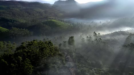 Aerial-drone-shot-drone-camera-is-moving-forward-and-the-sun-rays-are-falling-super-and-the-fog-is-visible