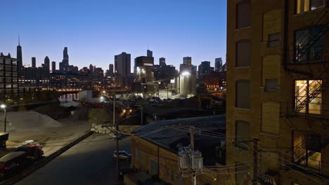 Static-drone-shot-of-heavy-machinery-at-the-Ozinga-Concrete,-dusk-in-Chicago,-USA