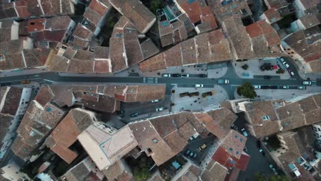 Top-down-tracking-shot-of-vehicles-travelling-through-the-streets-of-Lambesc