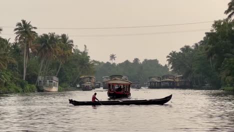 pov-shot-Many-boats-are-going-in-the-middle-of-the-water-and-sunset-time-is-happening-beutiful-shot-of-Kerala