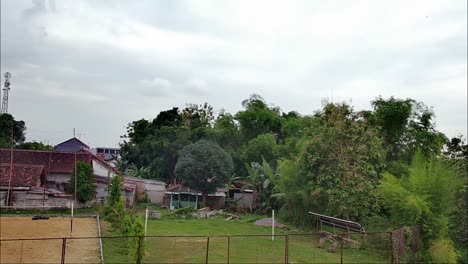 A-number-of-girls-play-volleyball-on-the-village-sports-field