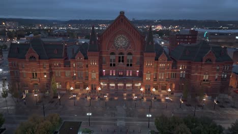 Cincinnati-Music-Hall-aerial-at-night,-establish-shot-in-United-States-of-America