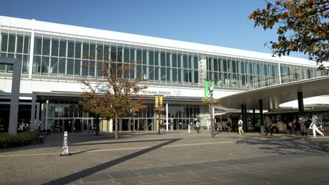 JR-Toyama-Station-public-transport-south-entrance,-moving-people-during-the-day,-Japan