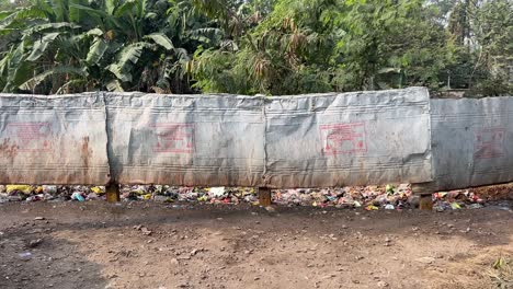 Garbage-piled-up-near-the-bypass-in-Kolkata,-India