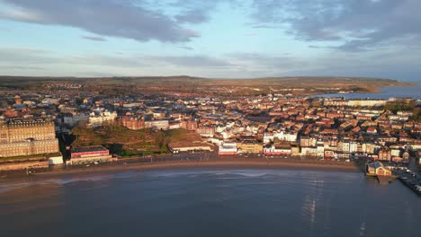 Aerial-top-shot-of-an-old-city-situated-beside-The-Grand-Hotel-in-a-sunny-day-in-Scarborough-North-Yorkshire,-England