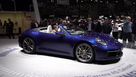 Geneva,-Switzerland---March-12th,-2019:-Wide-shot-of-a-blue-Porsche-Carrera-4S,-Autosalon-Geneva-Motor-Show-,-Switzerland