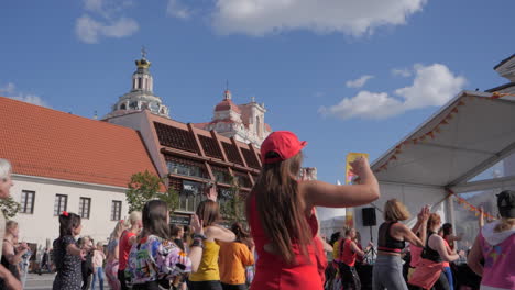 Many-women-latin-dancing-in-city-center,-slow-motion