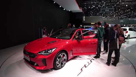 Geneva,-Switzerland---March-12th,-2019:-wide-slow-motion-shot,-KIA-Stinger,-KIA-booth,-Autosalon-Geneva-Motor-Show-2019