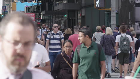 Long-shot-Slow-Motion-Close-up-of-large-group-of-pedestrians-crossing-in-midtown-Manhattan