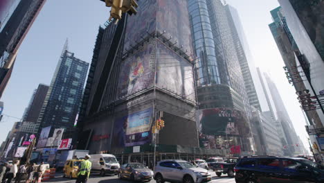 Wide-Angle-Tilt-up-of-busy-intersection-in-slow-motion-midtown-Manhattan