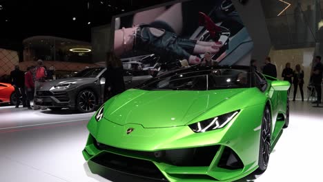 Geneva,-Switzerland---March-12th,-2019:-Medium-shot-of-a-green-Lamborghini-Huracan-Evo-Spyder,-Autosalon-Geneva-Motor-Show-2019,-Switzerland