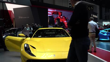 Geneva,-Switzerland---March-12th,-2019:-Medium-shot-of-a-yellow-Ferrari-at-the-Ferrari-booth-at-Autosalon-Geneva-Motor-Show-2019,-Switzerland