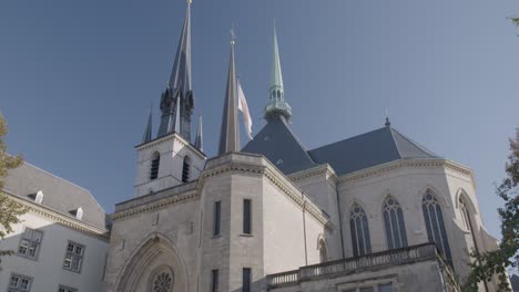 Tilt-up-shot-of-Notre-Dame-Cathedral's-Gothic-architecture-against-a-clear-blue-sky