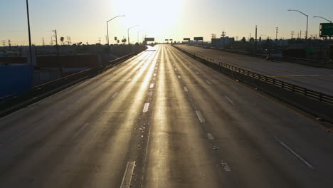 Aerial-view-flying-over-the-Santa-Monica-freeway-shut-down-after-a-fire-in-LA,-USA