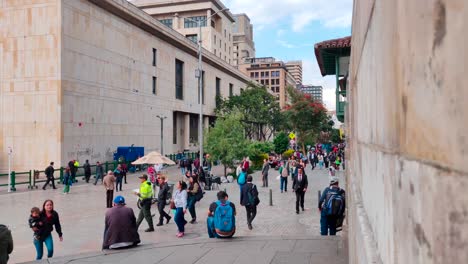 Tourists-and-local-people-walking-on-a-pedestrian-street-in-the-Historic-Center-of-Bogotá,-Colombia