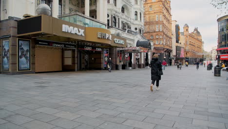 London-in-Covid-19-Coronavirus-lockdown-at-Leicester-Square-with-unusually-quiet-streets-and-the-Imax-and-Empire-Casino-closed,-shut-due-to-the-global-pandemic-in-England,-Europe