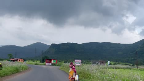 Indian-women-walking-along-road-around-Tiger-Point,-Lonavala