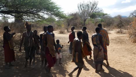 Members-of-the-primitive,-nomadic-Hadzabe-tribe-in-Tanzania-perform-a-celebratory-dance-for-visitors