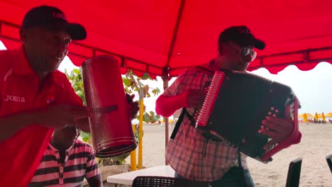 A-man-is-playing-the-Guacharaca-and-the-accordion