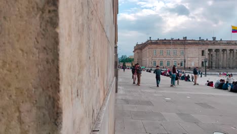 Tourists-walking-on-the-plaza-of-the-Historic-Center-of-Bogotá,-Colombia