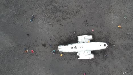 drone-fly-above-the-most-famous-flight-in-iceland,-layed-down-black-sand-beach