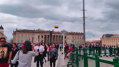 Tourists-and-local-people-walking-on-the-main-Plaza-of-the-Historic-Center-of-Bogotá,-Colombia