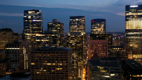 Hyperlapse-drone-shot-flying-in-middle-of-buildings-in-River-North,-dusk-in-Chicago,-USA