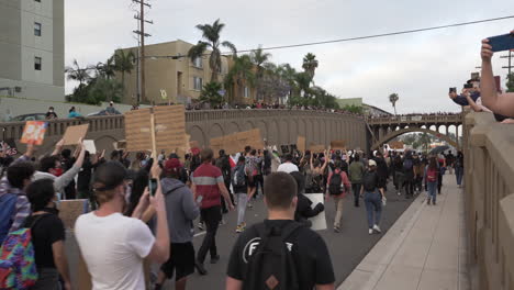 Hundreds-of-protesters-hold-signs-and-chant-during-a-black-lives-matter-protest-North-Park,-San-Diego,-CA