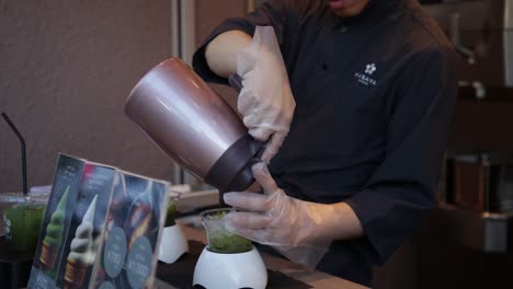 Bartender-serving-a-green-tea-in-the-streets-of-Kyoto-Japan