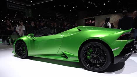 Geneva,-Switzerland---March-12th,-2019:-Medium-shot-of-a-green-Lamborghini-Huracan-Evo-Spyder,-Autosalon-Geneva-Motor-Show-2019,-Switzerland