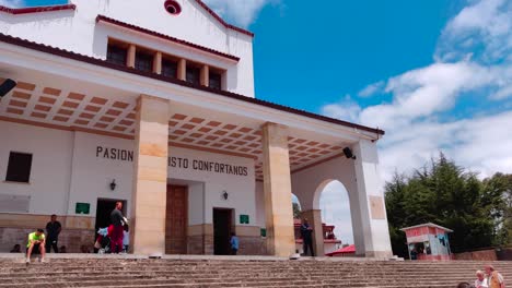 Tourists-are-walking-towards-a-church-located-on-the-top-of-the-Monserrate-cable-car-in-Bogotá,-Colombia