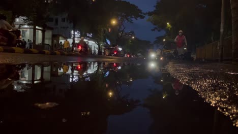 Puddle-of-water-on-streets-of-Mumbai-after-rain,-India