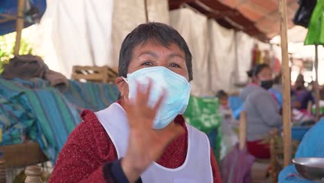 Footage-of-a-happy-Peruvian-elderly-woman-waving-at-the-camera,-Yungay,-Peru