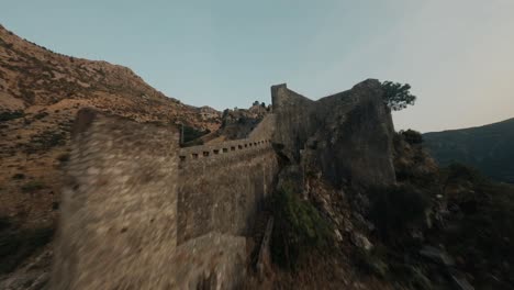 Flying-with-FPV-drone-in-Montenegro-during-sunset-over-old-town-of-Kotor