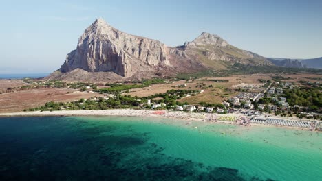 Aerial-drone-shot-at-the-beach-of-San-Vito-Lo-Capo-in-Sicily-during-daytime