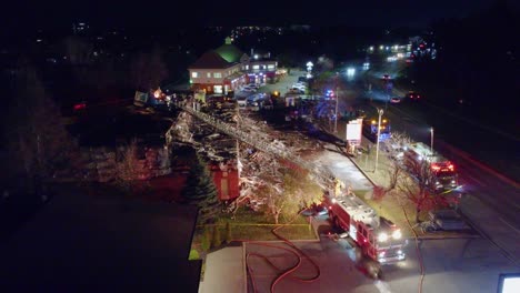 Fire-Trucks-Illuminating-Area-After-Extinguishing-Inferno-at-Night