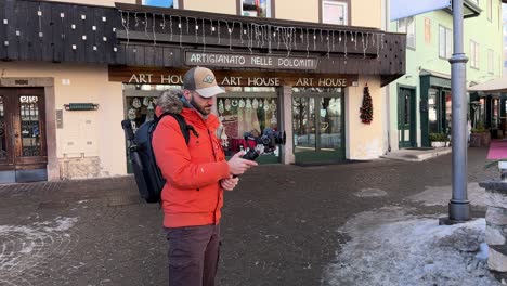 Male-Traveler-With-Camera-In-Handheld-Gimbal-Stabiliser-In-Italy