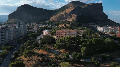 drone-flying-away-from-Mount-Pellegrino-mountain-while-Villa-Belmonte-is-visible-in-the-middle-of-the-frame