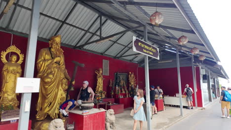 Tourists-visiting-the-Big-Buddha-at-Phuket,-Thailand