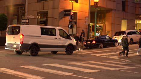 Vehicles-drive-down-street-in-downtown-San-Francisco