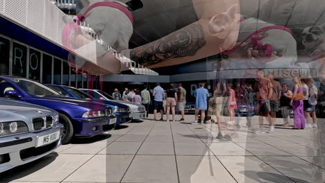 People-queueing-to-get-into-museum-in-Munich,-Germany-during-50-Year-celebrations-of-BMW-car-editorial