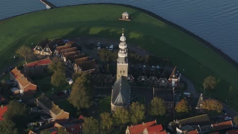 Aerial-drone-view-of-small-village-with-orange-roofs,-Hindeloopen,-Friesland