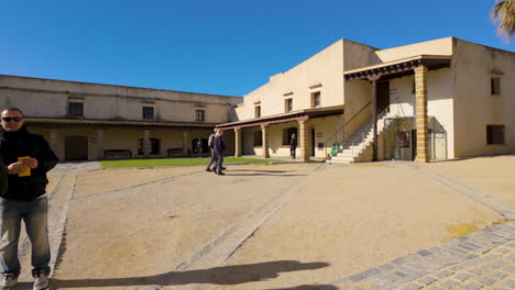 Historical-fortress-turned-museum-in-Cadiz-with-visitors-walking