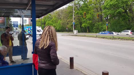 midday-footage-of-people-waiting-at-the-Tokuda-Hospital-bus-stop