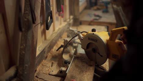 A-Man-is-Utilizing-a-Circular-Saw-to-Trim-the-Lumber-in-Indre-Fosen,-Trondelag-County,-Norway---Close-Up